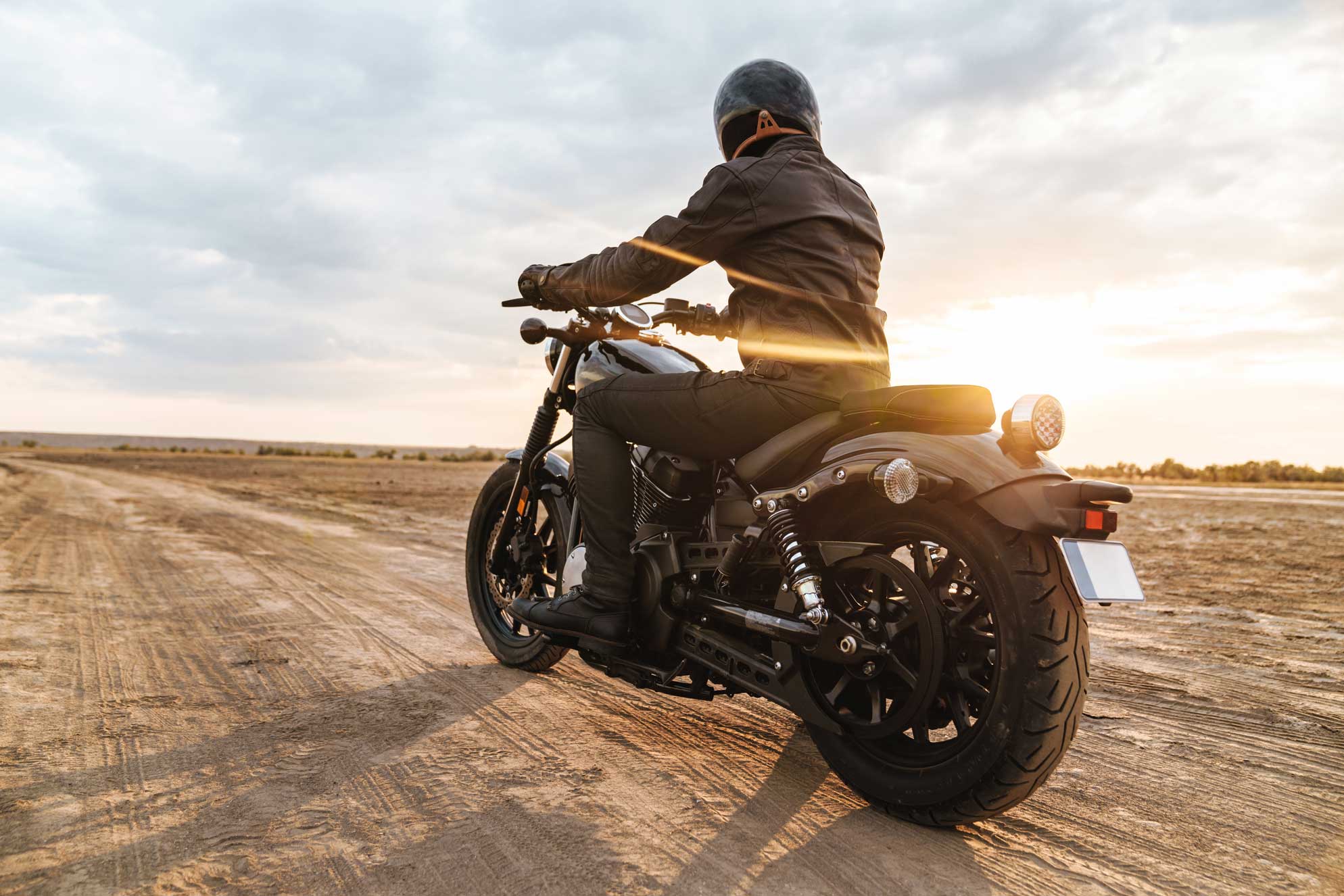 Handsome young man biker on bike outdoors